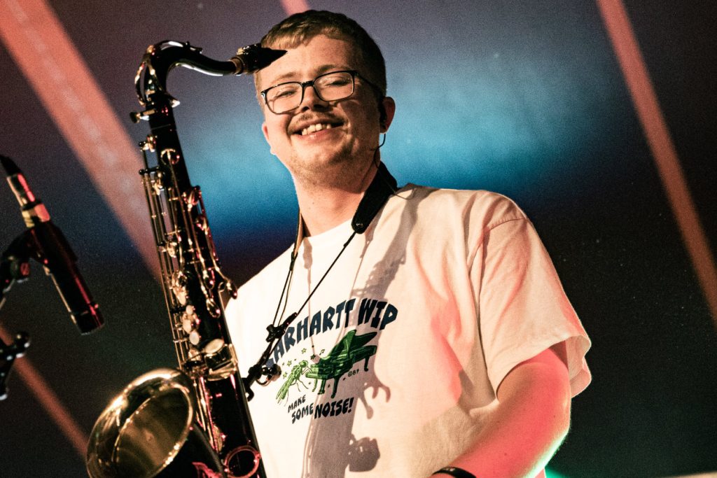 Dub Catalyst saxophone player Alex "The Guvnor" performing live, close-up archive photo, Lakefest 2025