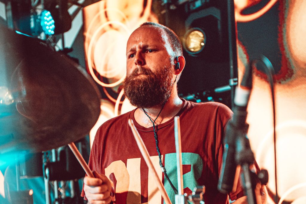 Down to the Nub, Glastonbury Dub Catalyst drummer Sam Fryer performing live, close-up archive photo, Mucky Weekender 2026